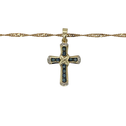 Add timeless beauty and classic sparkle to your collection with this pre-owned 9ct yellow gold diamond and sapphire set cross pendant on an 18" Singapore chain necklace — a refined piece that blends faith and elegance.

Design: The pendant features a delicate cross adorned with rich blue sapphires and sparkling diamonds, creating a graceful balance of colour and brilliance. Measuring 2.5cm long including the bail, it offers a subtle yet eye-catching presence.