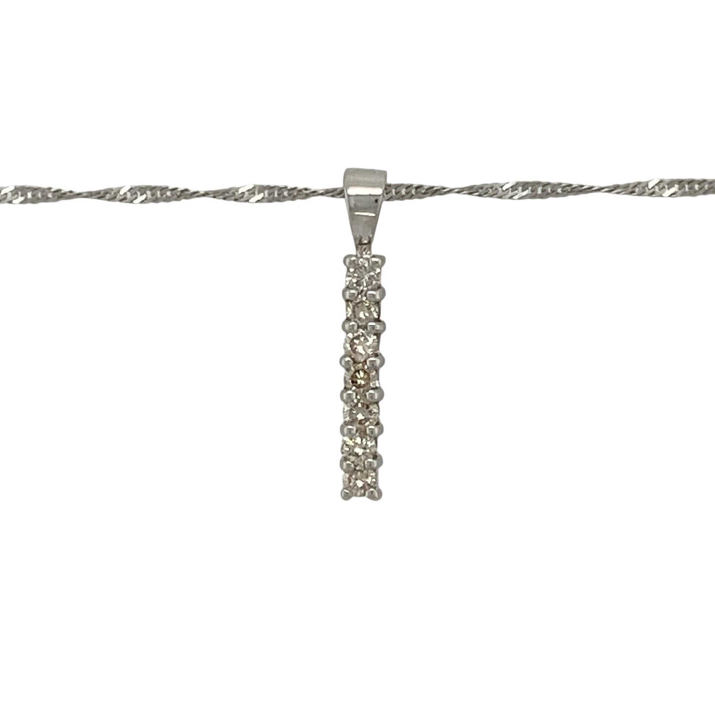 Add refined sparkle and modern elegance to your collection with this pre-owned 9ct white gold seven-stone diamond set bar pendant on an 18" Singapore chain necklace — a sleek and timeless design perfect for any occasion.

Design: The pendant features a vertical bar set with seven sparkling diamonds, creating a clean, contemporary look that catches the light beautifully. Measuring 2cm long including the bail, it offers understated sophistication with radiant sparkle.