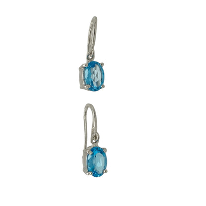 Add graceful colour and timeless sparkle to your collection with these pre-owned 9ct white gold oval blue stone drop earrings — an elegant design that combines refined simplicity with classic beauty.

Design: Each earring features an oval-cut blue stone measuring 7mm by 5mm, suspended in a sleek drop style that catches the light beautifully with every movement.
Material: Made from 9-carat white gold, the cool tone enhances the vivid blue of the stones and provides a polished, contemporary finish.