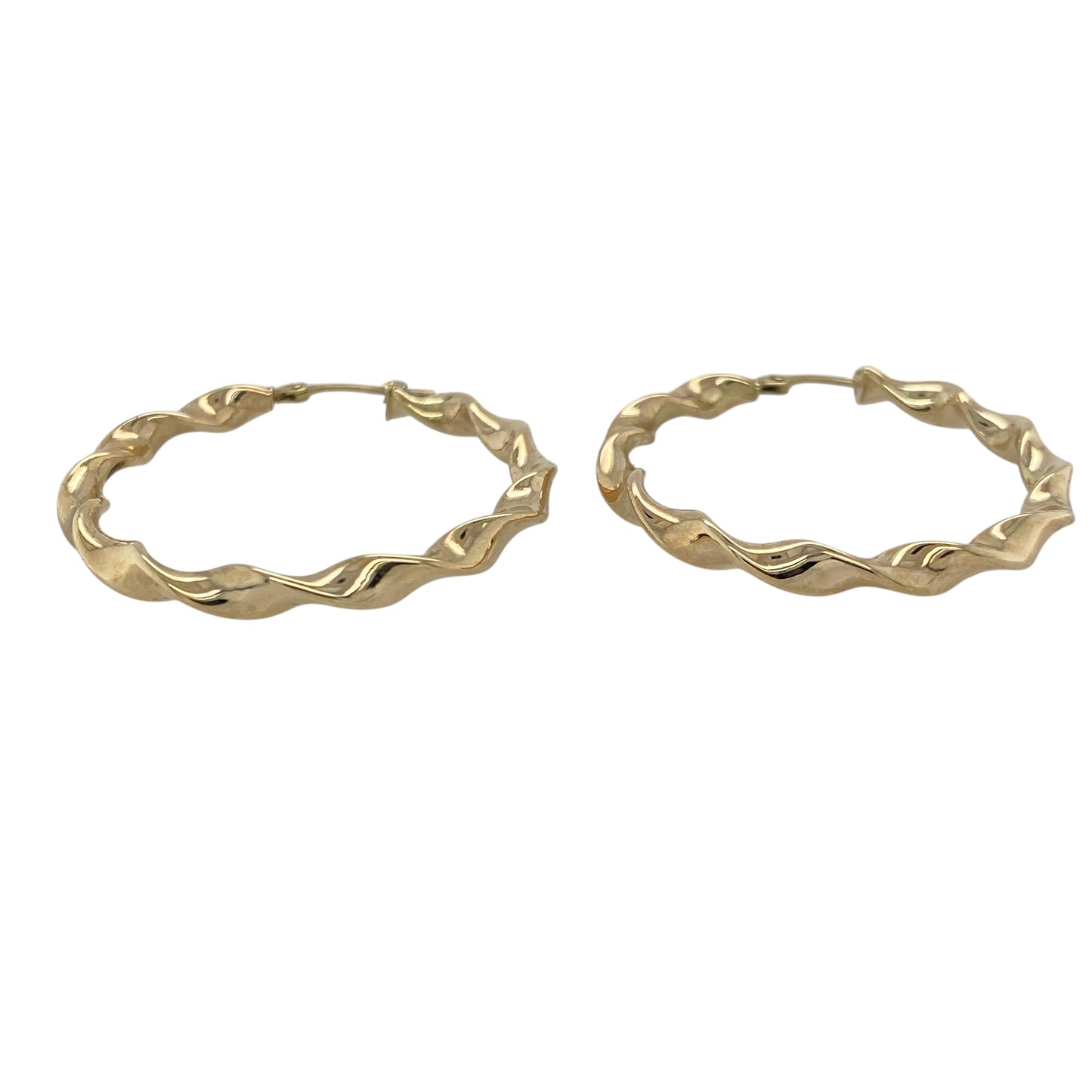 Add graceful movement and classic shine to your collection with these pre-owned 9ct yellow gold twist ribbon hoop creole earrings — a timeless design that combines elegance with everyday versatility.

Design: Each earring features a flowing twist ribbon pattern that catches the light beautifully, creating a subtle play of texture and shine in a classic creole hoop style.
Material: Made from 9-carat yellow gold, the warm tone enhances the sculpted design and offers a polished, luxurious finish.
