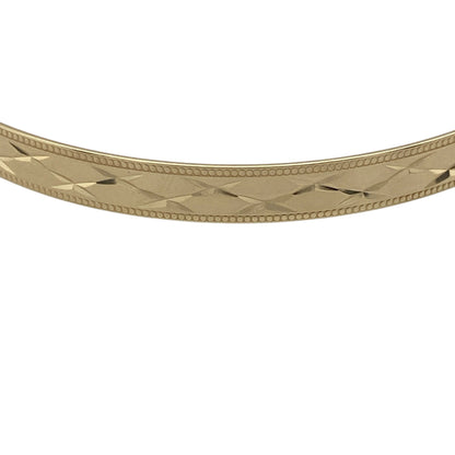 Pre-owned 9ct Solid Yellow Gold Patterned Expanding Bangle with the weight 5.50 grams and bangle width 5mm.