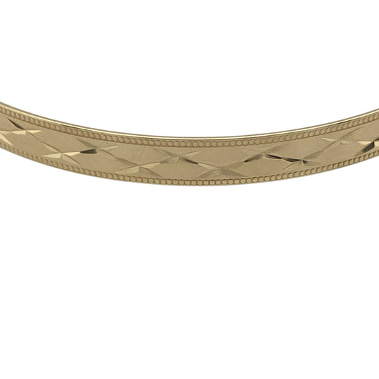 Pre-owned 9ct Solid Yellow Gold Patterned Expanding Bangle with the weight 5.50 grams and bangle width 5mm.