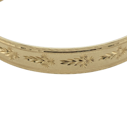 Pre-owned 9ct Solid Yellow Gold Patterned Expanding Bangle with the weight 15.50 grams and bangle width 9mm.
