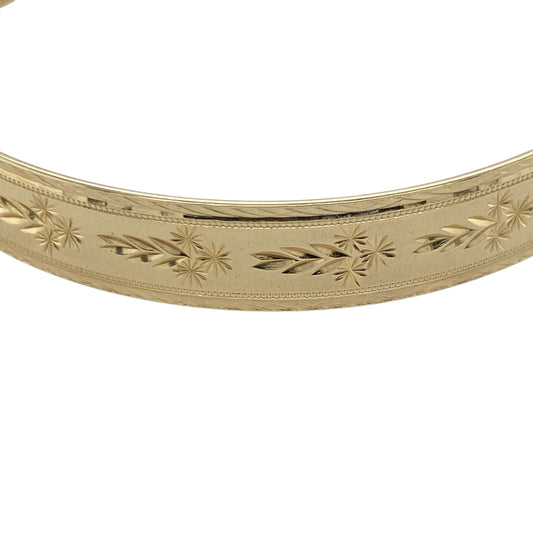 Pre-owned 9ct Solid Yellow Gold Patterned Expanding Bangle with the weight 15.50 grams and bangle width 9mm.