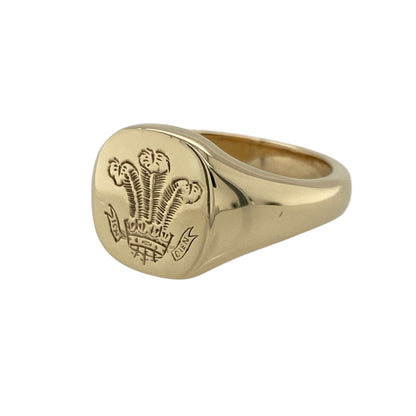 Pre-owned 9ct Yellow Gold Welsh Rounded rectangle Three Feathers Signet Ring in size W to X with the weight 11.90 grams. The front of the ring is 13mm high