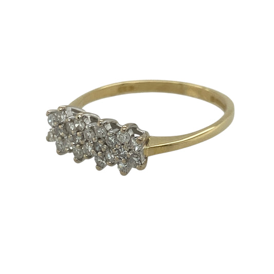 Bring floral elegance and radiant sparkle to your collection with this pre-owned 18ct yellow gold diamond set flower cluster band ring, offering timeless charm and refined brilliance—perfect for both everyday wear and special occasions.

Design: The ring features a beautiful flower cluster design adorned with diamonds totalling approximately 0.31ct, creating a delicate yet eye-catching arrangement.