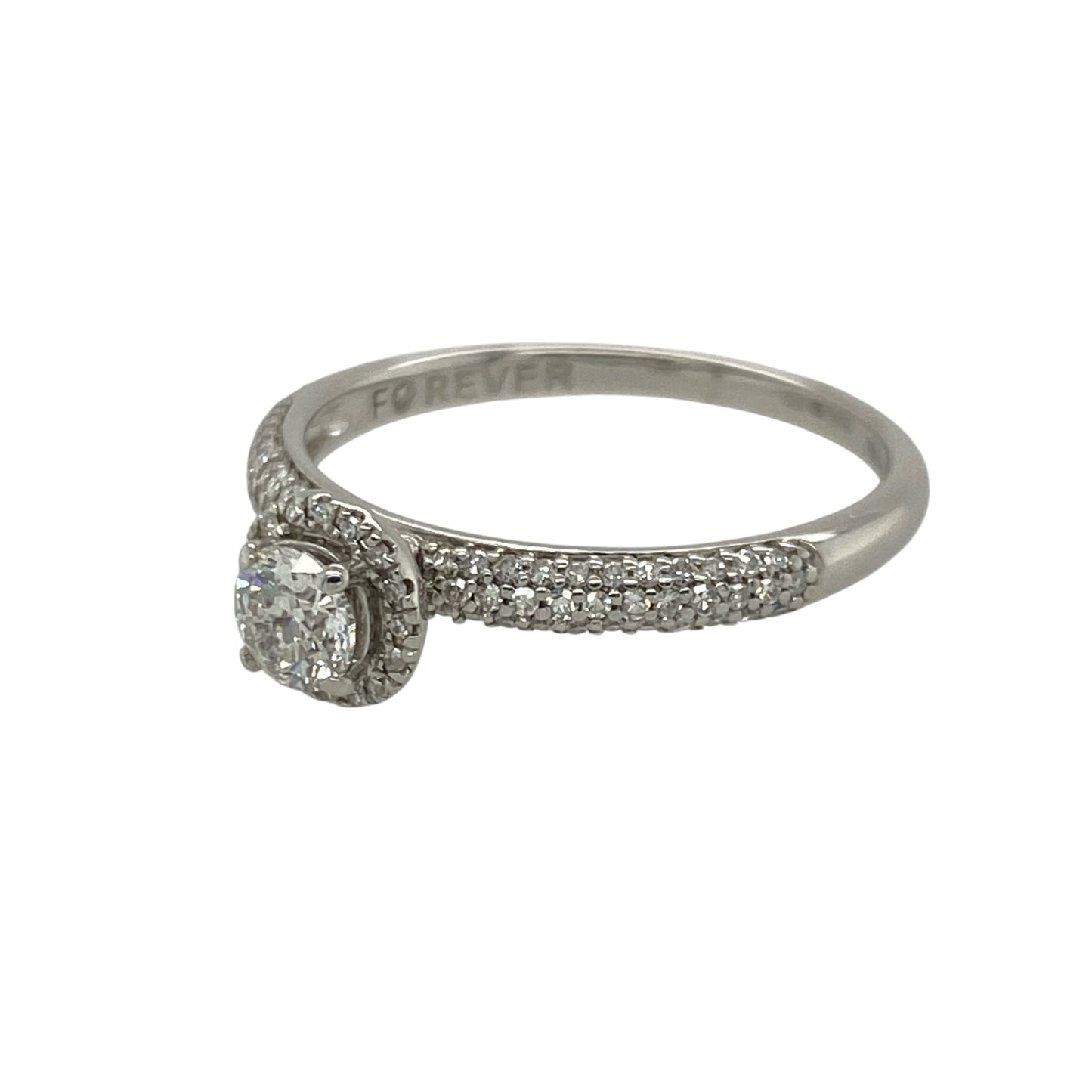 Pre-owned 18ct White Gold &amp; Diamond Halo Ring with diamond set shoulders and a brilliant cut diamond in the center. The ring is in size O with the wight 2.30 grams. There is approximately 0.50ct of diamond content set in total with approximate clarity Si2 and colour K - M