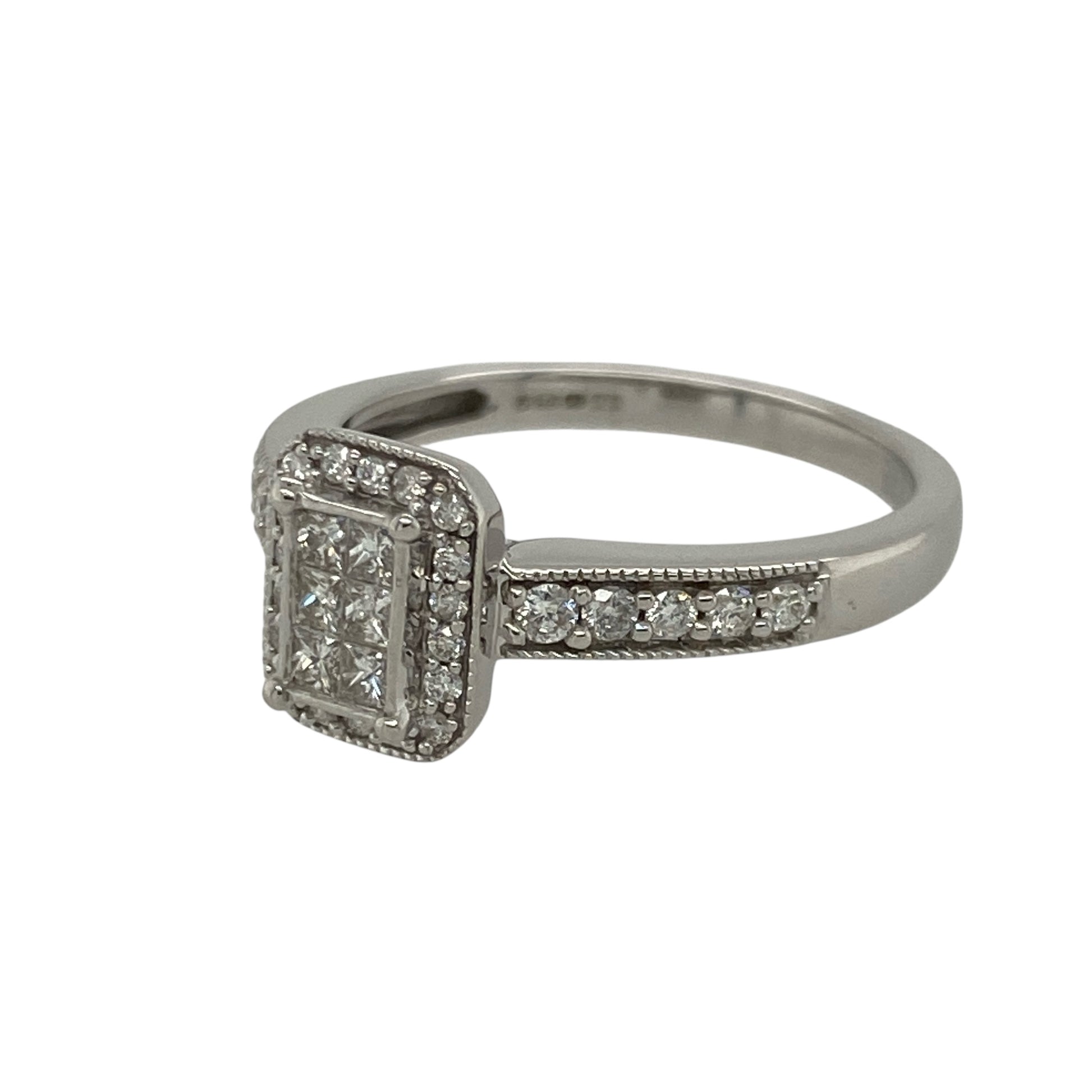 Pre-owned 9ct White Gold &amp; Diamond Set Halo Cluster Ring in size L with the weight 2.40 grams. The front of the ring is 9mm high and there is approximately 0.50ct of diamond content set in total. The ring has diamond set split shoulders