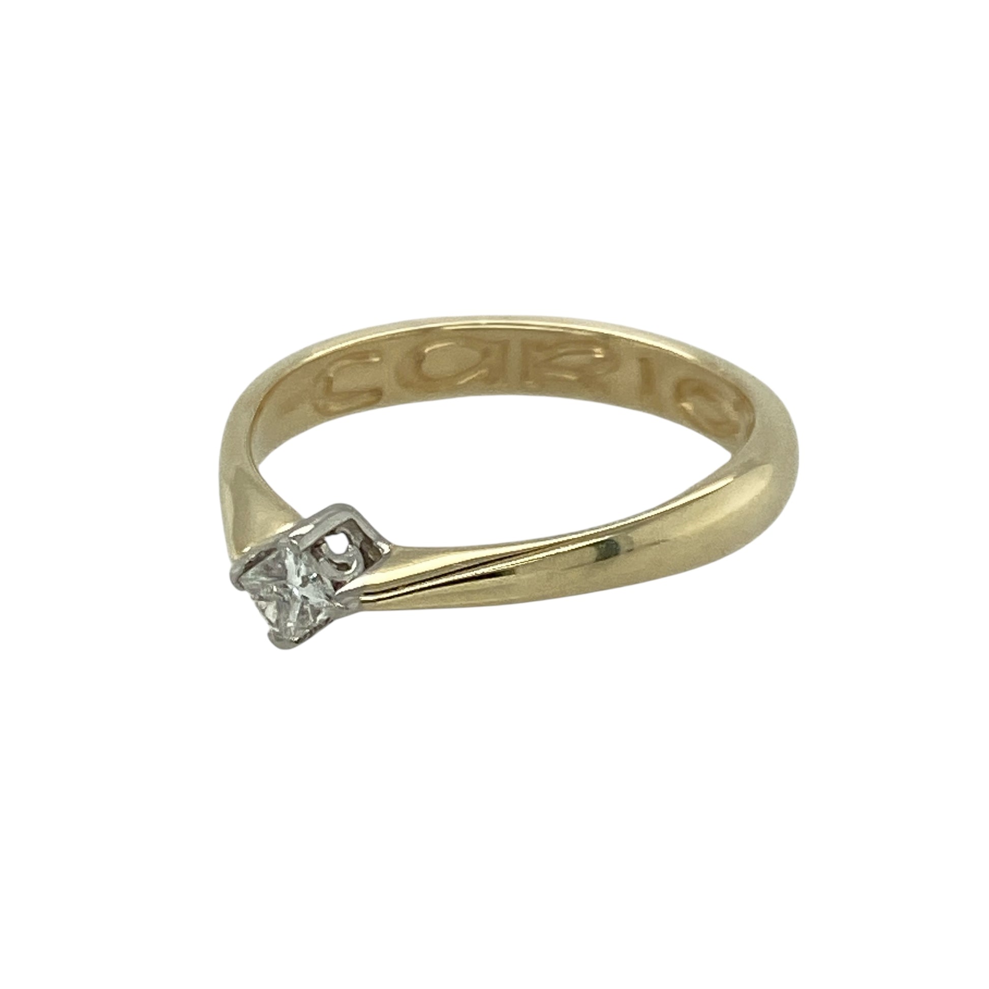 Embrace elegant simplicity and heartfelt meaning with this pre-owned 9ct yellow gold and diamond Clogau Cariad solitaire ring, symbolising love and connection—perfect for everyday wear or as a sentimental gift.

Design: The ring features an offset princess-cut diamond of approximately 0.10ct, offering subtle sparkle with a contemporary twist on the classic solitaire style.