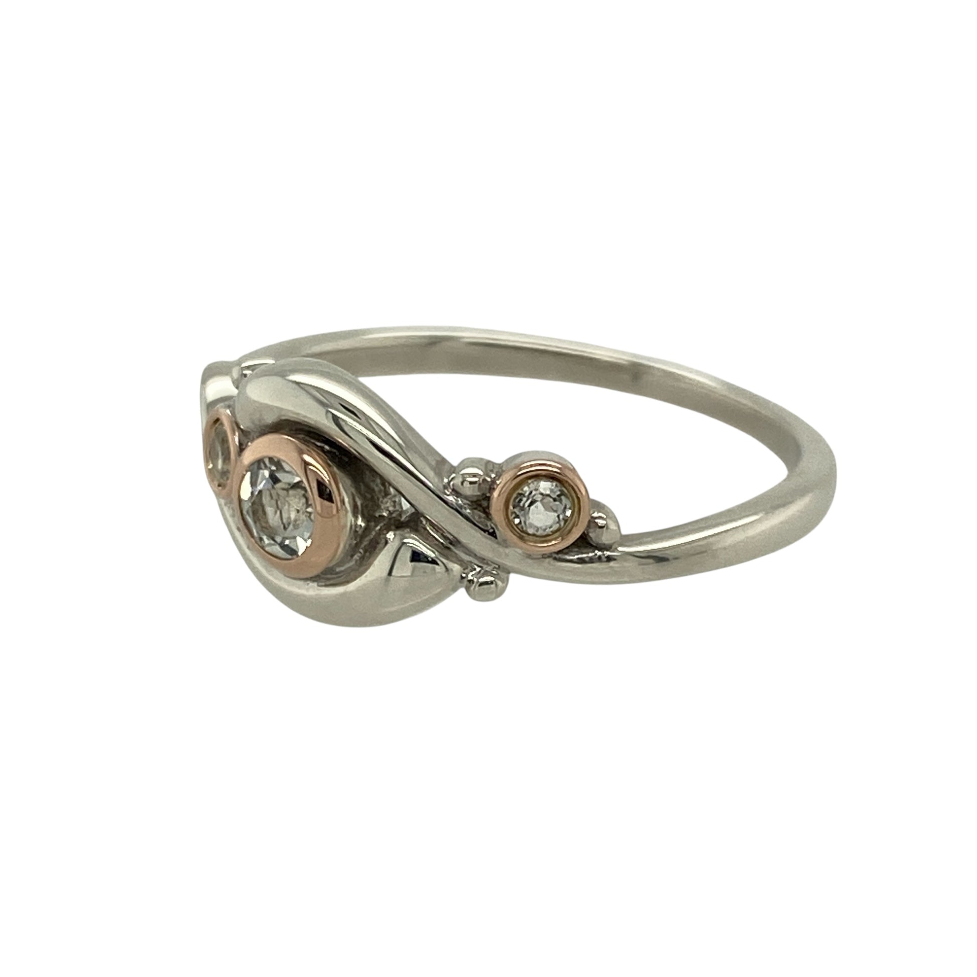 Capture natural beauty and serene elegance with this pre-owned 925 silver and white topaz Clogau Pistyll Rhaeadr ring, inspired by the breathtaking Welsh waterfall it’s named after—perfect for adding a touch of sparkle and meaning to your collection.

Design: The ring features flowing, organic lines that reflect the movement of cascading water, adorned with white topaz stones that shimmer like droplets in sunlight. The front of the ring measures 9mm high, creating a graceful and eye-catching design.