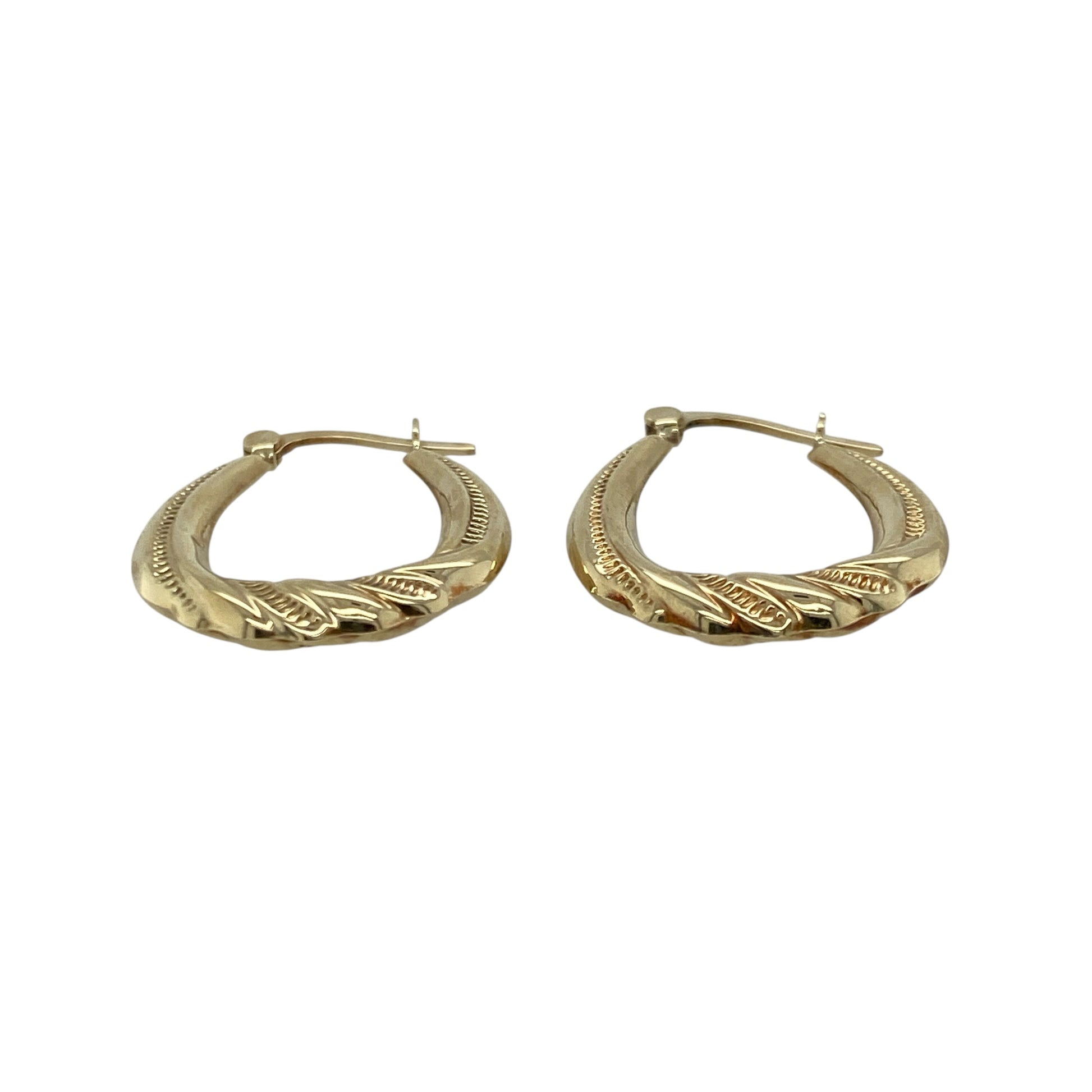 Add delicate shine and timeless style to your look with these pre-owned 9ct yellow gold patterned twist oval creole earrings, offering a classic design with elegant detail—perfect for everyday wear or subtle sophistication.

Design: Each earring features an oval creole shape with a refined twisted pattern, adding gentle texture and light-catching movement.
Material: Made from 9-carat yellow gold, the polished finish enhances the warm tone and highlights the intricate twist design.