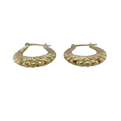 Add classic elegance and subtle texture to your collection with these pre-owned 9ct yellow gold patterned creole earrings, offering timeless style with a touch of intricate detail—perfect for everyday wear or special occasions.

Design: Each earring features a traditional creole hoop shape adorned with delicate patterned detailing that catches the light beautifully.
Material: Made from 9-carat yellow gold, the polished finish enhances the warm tone of the metal and adds refined shine.