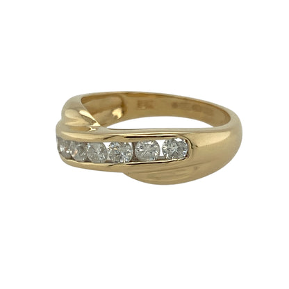 Bring brilliance and contemporary style to your collection with this pre-owned 18ct yellow gold diamond set crossover band ring—a striking design that exudes modern elegance and luxury.

Design: The ring features a flowing crossover band design adorned with approximately 0.50ct of sparkling diamonds, creating a sense of movement and sophistication.
Material: Made from 18-carat yellow gold, the polished finish enhances the contrast between the warm gold tone and the dazzling diamond detailing.