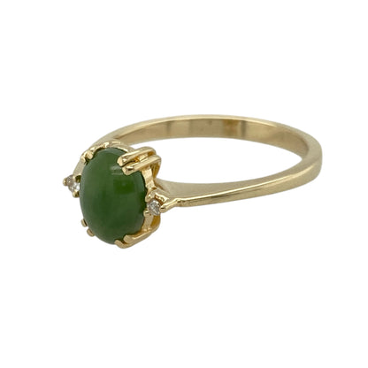 Bring natural beauty and elegant simplicity to your collection with this pre-owned 14ct yellow gold diamond and jade set ring—a refined piece that blends timeless style with serene colour.

Design: The ring features an 8mm by 6mm oval jade stone at the centre, flanked by a small diamond on either side, creating a graceful balance of soft green hues and subtle sparkle.
Material: Made from 14-carat yellow gold, the warm tone enhances the richness of the jade and complements the brilliance of the diamonds.