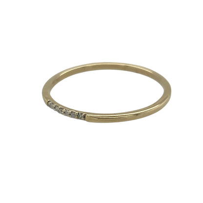Bring subtle sparkle and understated elegance to your collection with this pre-owned 9ct yellow gold diamond set band ring—a delicate piece that adds a refined touch to any look.

Design: The ring features six small diamonds set across the front of the slim 1mm wide band, offering a subtle shimmer that catches the light beautifully.
Material: Made from 9-carat yellow gold, the polished finish enhances the sparkle of the diamonds and provides a warm, timeless glow. 