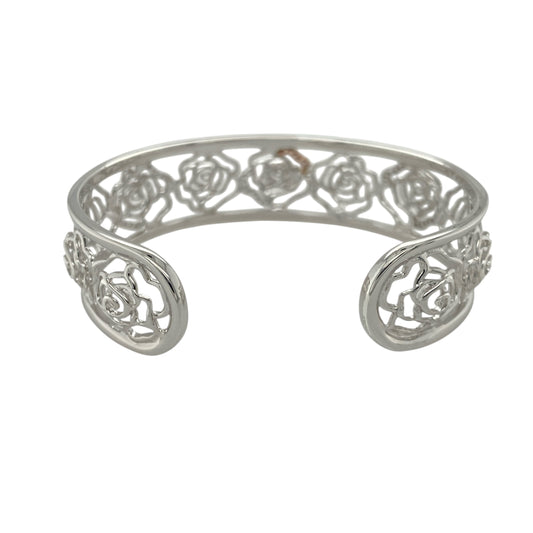 Add statement elegance and floral beauty to your collection with this pre-owned 925 silver and 9ct rose gold Clogau rose flower cuff bangle, combining timeless craftsmanship with radiant sparkle—perfect for special occasions or sophisticated everyday wear.

Design: The bangle features an intricate rose flower motif adorned with white topaz stones, adding graceful shimmer and depth. The front of the bangle measures 17mm wide, creating a striking and feminine focal point.
