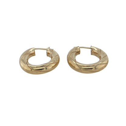 Add classic elegance and refined shine to your collection with these pre-owned 9ct yellow gold oval twist creole earrings, offering timeless style with a touch of modern flair—perfect for everyday wear or special occasions.

Design: Each earring features an oval creole shape with a graceful twisted design, creating soft movement and beautiful light reflection from every angle.
Material: Made from 9-carat yellow gold, the polished finish enhances the rich golden tone and adds lasting brilliance.
