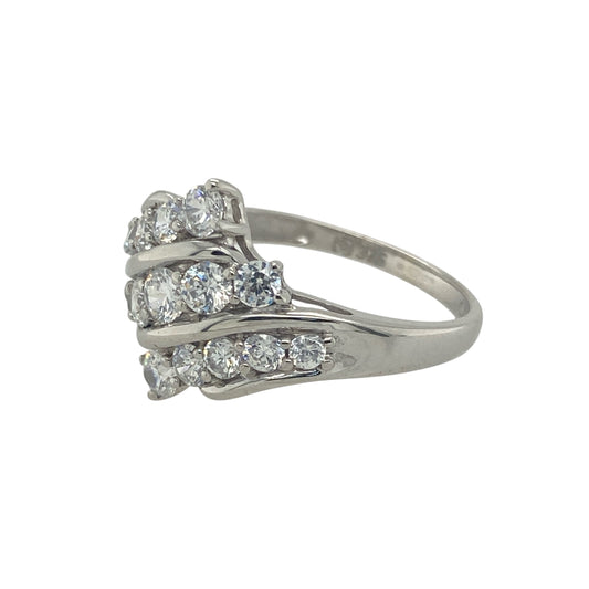 Add refined sparkle and contemporary elegance to your collection with this pre-owned 9ct white gold cubic zirconia three-row diagonal ring, offering a modern twist on classic brilliance—perfect for everyday wear or evening sophistication.

Design: The ring features three diagonal rows of five cubic zirconia stones each, creating a striking pattern that catches the light beautifully from every angle.
