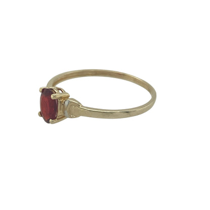 Add a touch of classic colour and elegance to your collection with this pre-owned 9ct yellow gold ruby-coloured stone ring—delicate in design yet rich in timeless appeal.

Design: The ring features an oval ruby-coloured stone measuring approximately 6mm by 4mm, offering a vibrant red hue that catches the light beautifully.
Material: Made from 9-carat yellow gold, the polished finish enhances the warmth of the gold and complements the richness of the central stone.
