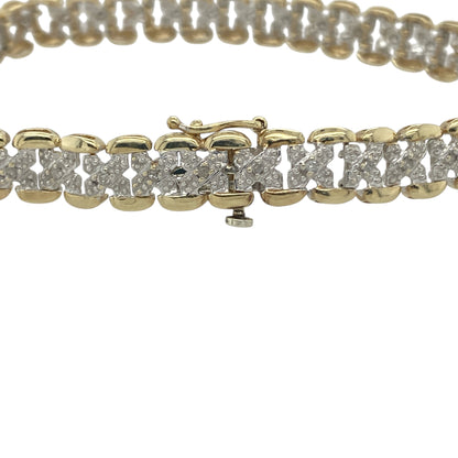 Add a touch of timeless sparkle to your collection with this pre-owned 9ct yellow gold diamond set bracelet—elegant, refined, and perfect for any occasion.

Design: The bracelet features a series of polished gold links accented with sparkling diamonds, creating a classic and sophisticated look that catches the light beautifully.
Material: Made from 9-carat yellow gold, the polished finish enhances the warm golden tone and complements the brilliance of the diamonds.
