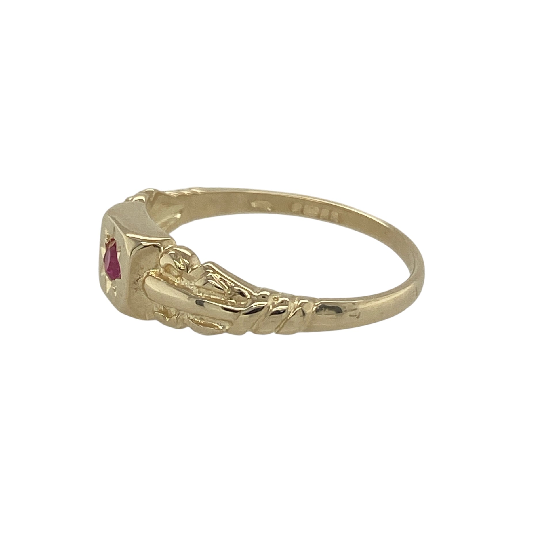 Add a touch of colour and celestial charm to your collection with this pre-owned 9ct yellow gold ruby set star signet ring—a stylish blend of classic design and vibrant detail.

Design: The ring features a central ruby measuring approximately 3mm by 3mm, elegantly star-set into the face of the ring for a subtle yet striking finish.
Material: Made from 9-carat yellow gold, the polished surface enhances the warmth of the metal and complements the rich red hue of the ruby.

