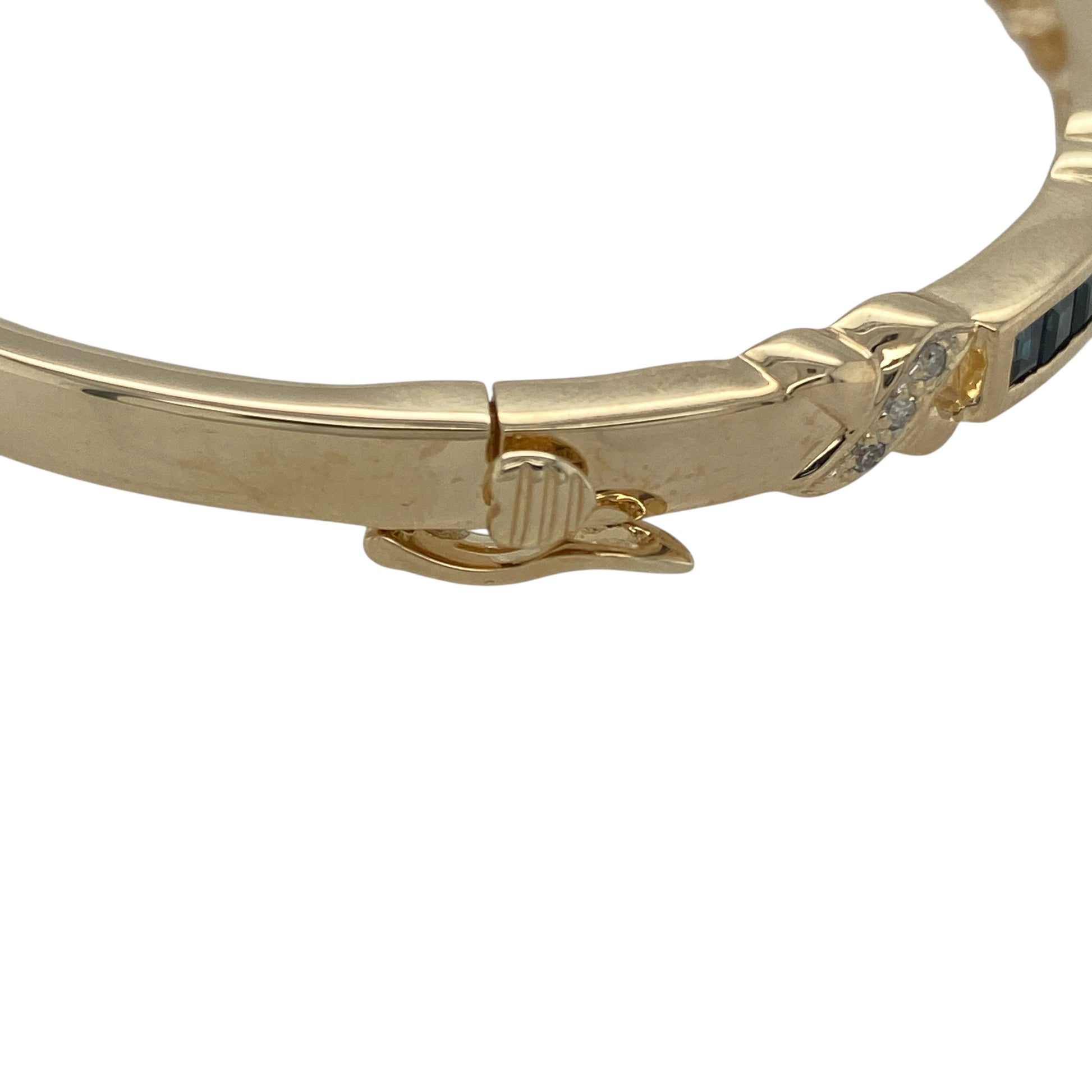 Add timeless elegance and refined colour to your collection with this pre-owned 9ct yellow gold diamond and sapphire set bangle—a luxurious statement piece perfect for any occasion.

Design: The bangle features a row of alternating sapphires and diamonds along the front, with the band measuring between 4mm and 5mm in height for a graceful, balanced look.
