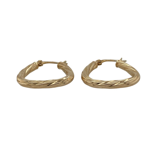 Bring unique shape and elegant texture to your collection with these pre-owned 9ct yellow gold twisted triangle creole earrings—an eye-catching pair with modern charm.

Design: Featuring a distinctive triangle-shaped creole hoop with a twisted pattern, these earrings offer a stylish blend of geometric form and refined texture.
Material: Made in 9-carat yellow gold, the polished finish enhances the twisted detailing with a warm, radiant shine.
