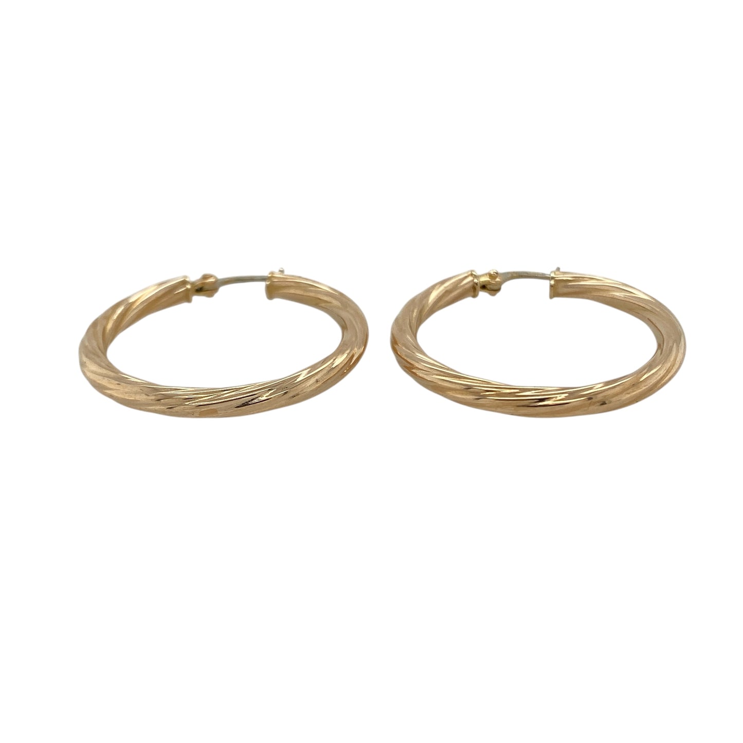 Bring elegant texture and timeless shine to your collection with these pre-owned 9ct yellow gold twisted hoop creole earrings—an eye-catching pair for any occasion.

Design: Featuring a traditional creole hoop enhanced with a refined twisted pattern, these earrings offer a stylish blend of texture and smooth curves.
Material: Made in 9-carat yellow gold, the polished finish highlights the twist detailing with a warm, radiant glow.