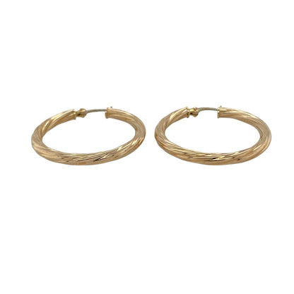 Bring elegant texture and timeless shine to your collection with these pre-owned 9ct yellow gold twisted hoop creole earrings—an eye-catching pair for any occasion.

Design: Featuring a traditional creole hoop enhanced with a refined twisted pattern, these earrings offer a stylish blend of texture and smooth curves.
Material: Made in 9-carat yellow gold, the polished finish highlights the twist detailing with a warm, radiant glow.