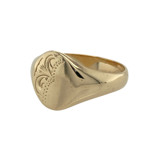 Bring classic character and refined detail to your collection with this pre-owned 9ct yellow gold patterned oval signet ring—an elegant piece with timeless appeal.

Design: Featuring an 11mm-high oval front adorned with a decorative patterned finish, the ring offers a distinctive focal point with traditional styling.
Material: Made in 9-carat yellow gold, the polished surface highlights the detailed pattern with a warm, radiant shine.