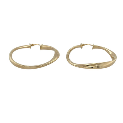 Bring elegant texture and classic shine to your collection with these pre-owned 9ct yellow gold twisted hoop creole earrings—an effortlessly stylish pair for any occasion.

Design: Featuring a traditional creole hoop enhanced with a refined twisted pattern, these earrings offer a graceful blend of texture and smooth curves.
Material: Made in 9-carat yellow gold, the polished finish highlights the twist detailing with a warm, radiant glow.