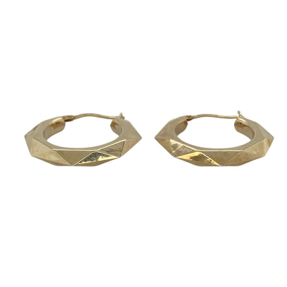 Bring unique texture and classic shine to your collection with these pre-owned 9ct yellow gold hex-patterned hoop creole earrings—an elegant pair with a distinctive look.

Design: Featuring a traditional creole hoop adorned with a hexagonal patterned finish, these earrings offer a striking blend of geometric detail and timeless style.
Material: Made in 9-carat yellow gold, the polished surface enhances the faceted pattern with a warm, radiant glow.