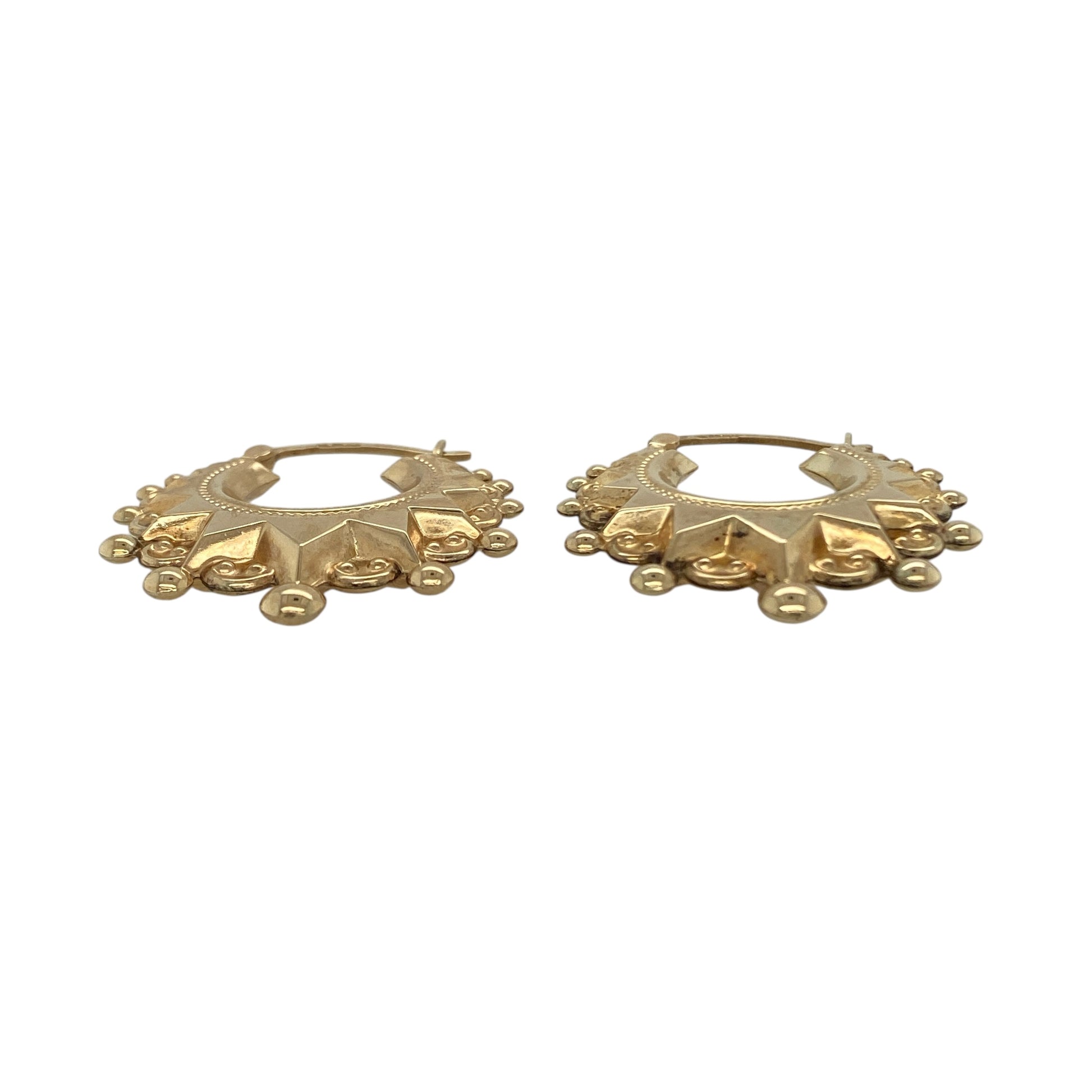 Bring bold texture and timeless shine to your collection with these pre-owned 9ct yellow gold fancy patterned hoop creole earrings—an elegant pair with classic appeal.

Design: Featuring a traditional creole hoop enhanced with an intricate fancy patterned finish, these earrings offer a richly detailed look that adds depth and sophistication.
Material: Made in 9-carat yellow gold, the polished surface highlights the ornate patterning with a warm, radiant glow.