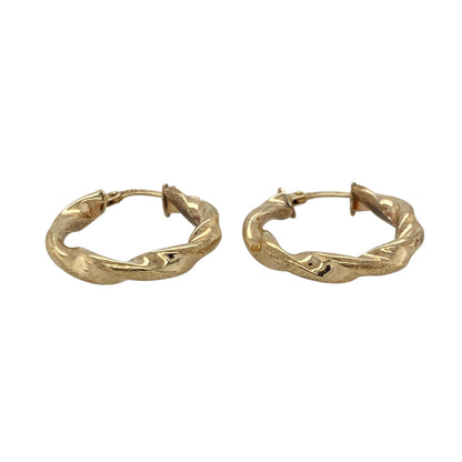 Bring refined texture and classic shine to your collection with these pre-owned 9ct yellow gold twisted brushed-effect hoop creole earrings—an elegant pair with timeless appeal.

Design: Featuring a traditional creole hoop enhanced with a twisted design and a subtle brushed-effect finish, these earrings offer a stylish blend of texture and sophistication.
Material: Made in 9-carat yellow gold, the combination of polished and brushed surfaces creates a warm, eye-catching contrast.
