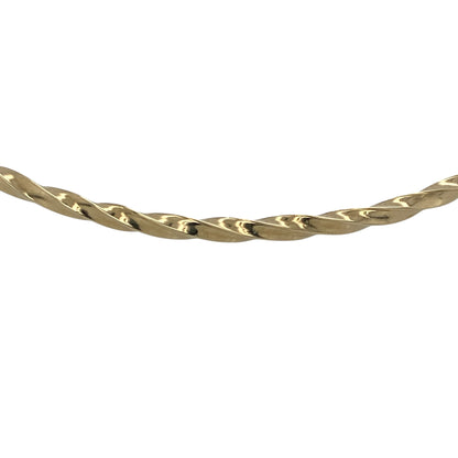 Bring elegant texture and classic shine to your collection with this pre-owned 9ct yellow gold twisted bangle—an understated yet stylish piece with timeless appeal.

Design: Featuring a slim 2mm-wide band with a refined twisted pattern, the bangle offers a graceful blend of texture and simplicity.
Material: Made in 9-carat yellow gold, the polished finish enhances the twisted detailing with a warm, radiant glow.