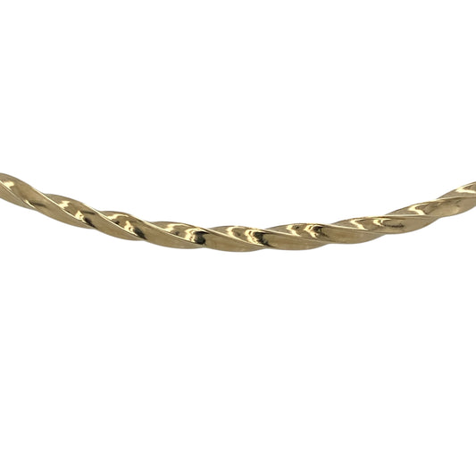 Bring elegant texture and classic shine to your collection with this pre-owned 9ct yellow gold twisted bangle—an understated yet stylish piece with timeless appeal.

Design: Featuring a slim 2mm-wide band with a refined twisted pattern, the bangle offers a graceful blend of texture and simplicity.
Material: Made in 9-carat yellow gold, the polished finish enhances the twisted detailing with a warm, radiant glow.