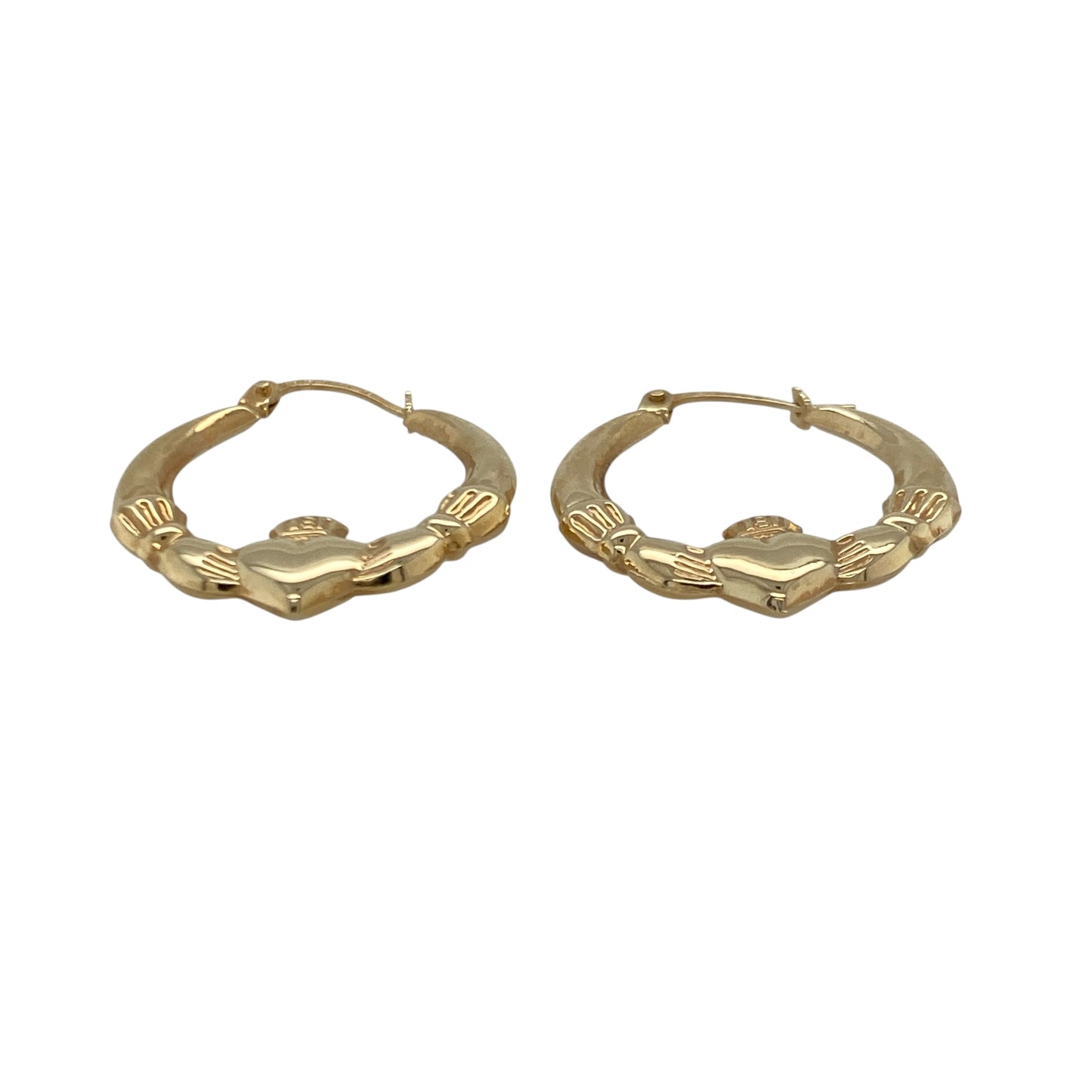 Bring meaningful symbolism and traditional charm to your collection with these pre-owned 9ct yellow gold Claddagh creole earrings—an elegant pair celebrating love, loyalty, and friendship.

Design: These delicate hoops feature the classic Claddagh motif—two hands holding a heart topped with a crown—beautifully incorporated into the creole shape for a timeless, symbolic look.
Material: Made from 9-carat yellow gold, the earrings offer a warm, polished shine that enhances their traditional design.