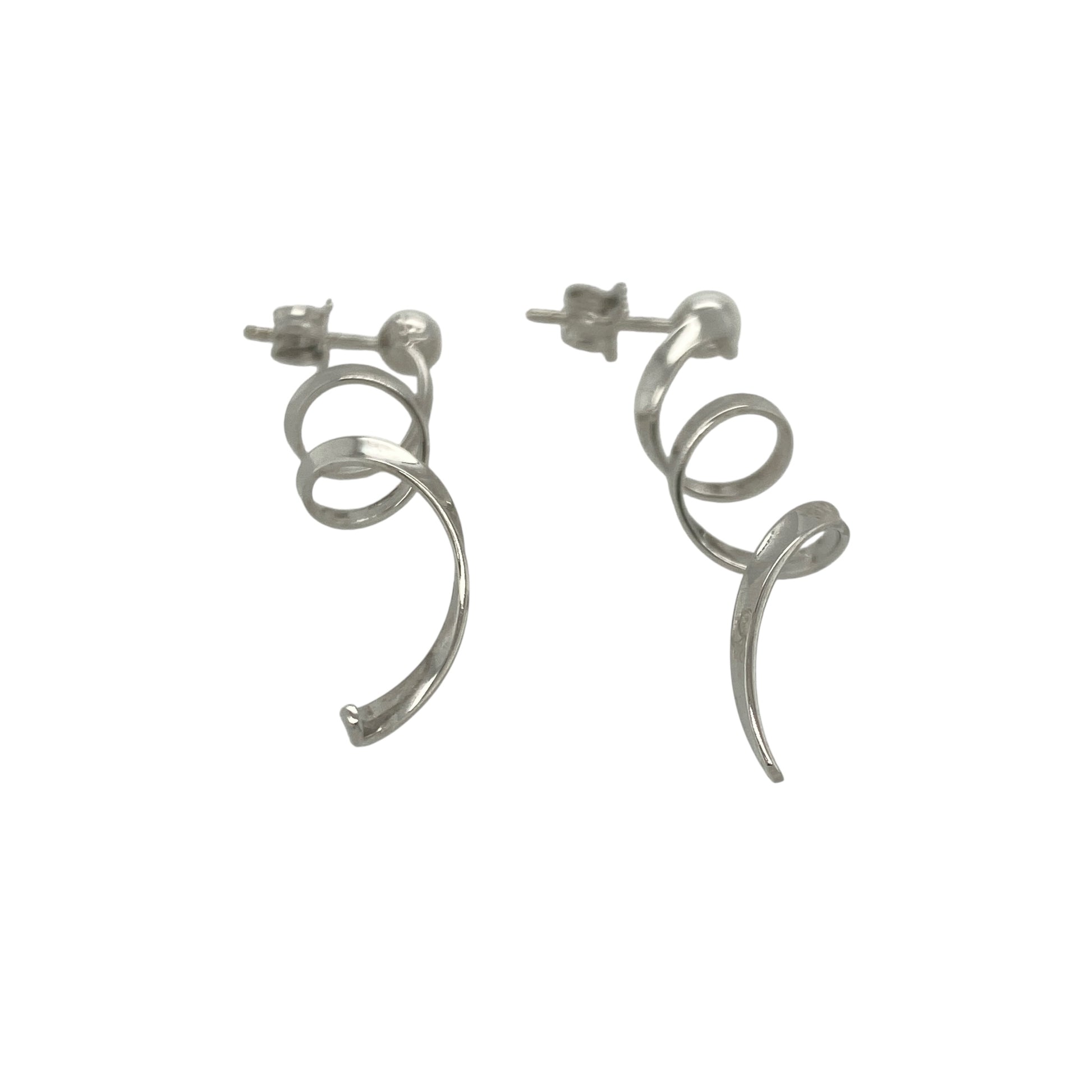 Bring modern elegance and graceful movement to your collection with these pre-owned 9ct white gold swirl drop earrings—an eye-catching pair offering contemporary style and refined shine.

Design: These earrings feature flowing swirl-shaped drops that create a sleek, sculpted look with gentle movement when worn.
Material: Made from 9-carat white gold, the cool-toned polished finish enhances their modern, radiant appeal.
