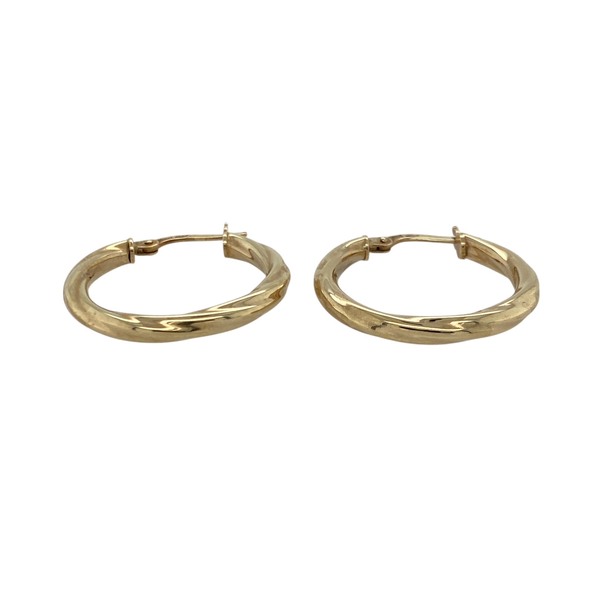 Bring elegant movement and classic golden shine to your collection with these pre-owned 9ct yellow gold twisted creole earrings—an attractive pair offering timeless style and subtle texture.

Design: These hoop creole earrings feature a twisted design that adds depth, light play, and a refined sense of movement to their traditional shape.
Material: Made from 9-carat yellow gold, the earrings have a polished, radiant finish that highlights the twist detailing.