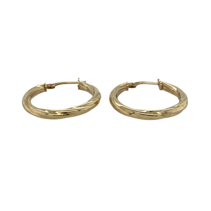 Bring elegant movement and classic golden shine to your collection with these pre-owned 9ct yellow gold twisted creole earrings—an attractive pair offering timeless style and subtle texture.

Design: These hoop creole earrings feature a twisted design that adds depth, light play, and a refined sense of movement to their traditional shape.
Material: Made from 9-carat yellow gold, the earrings have a polished, radiant finish that highlights the twist detailing.