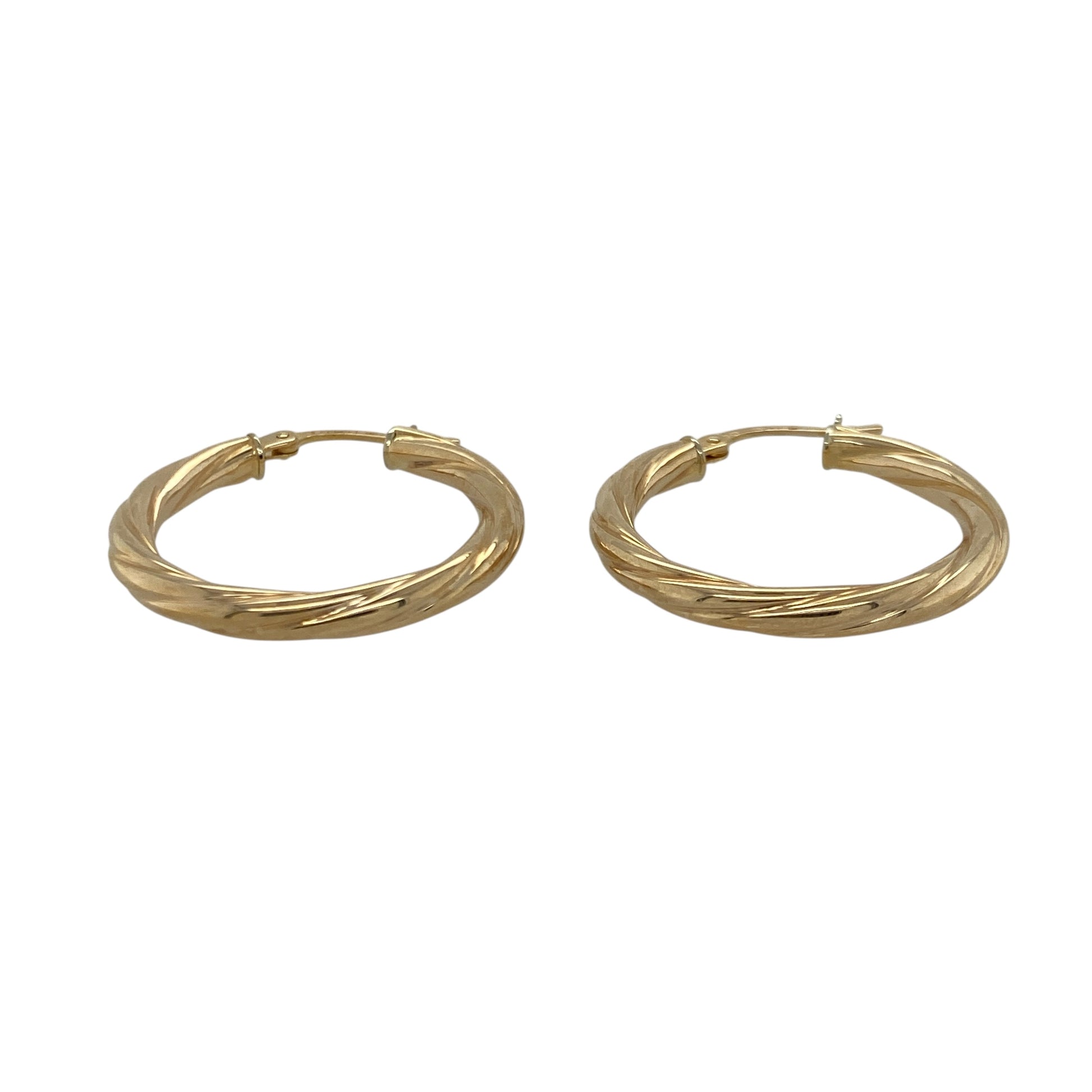 Bring elegant movement and warm golden tone to your collection with these pre-owned 9ct yellow gold twisted creole earrings—an attractive pair offering timeless style and subtle texture.

Design: These hoop creole earrings feature a twisted shape that adds depth, gentle light play, and refined visual interest to their classic form.
Material: Made from 9-carat yellow gold, the earrings display a polished, radiant finish that enhances the twist detailing.