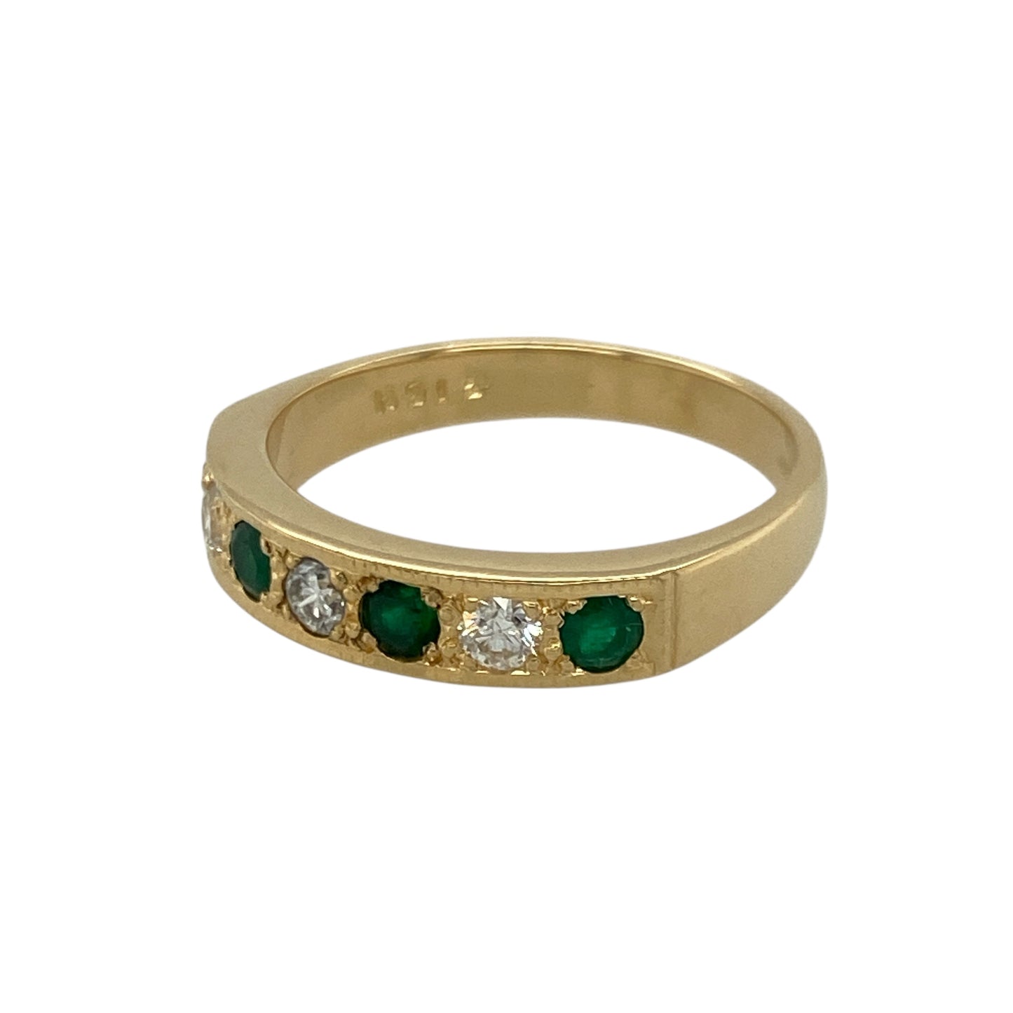 Bring rich colour and refined sparkle to your collection with this pre-owned 18ct yellow gold diamond and emerald band ring—an elegant piece offering timeless beauty and luxurious presence.

Design: This size O band features three vibrant 3mm round emeralds arranged across the front, complemented by diamonds totalling approximately 0.18ct for added brilliance and balance.