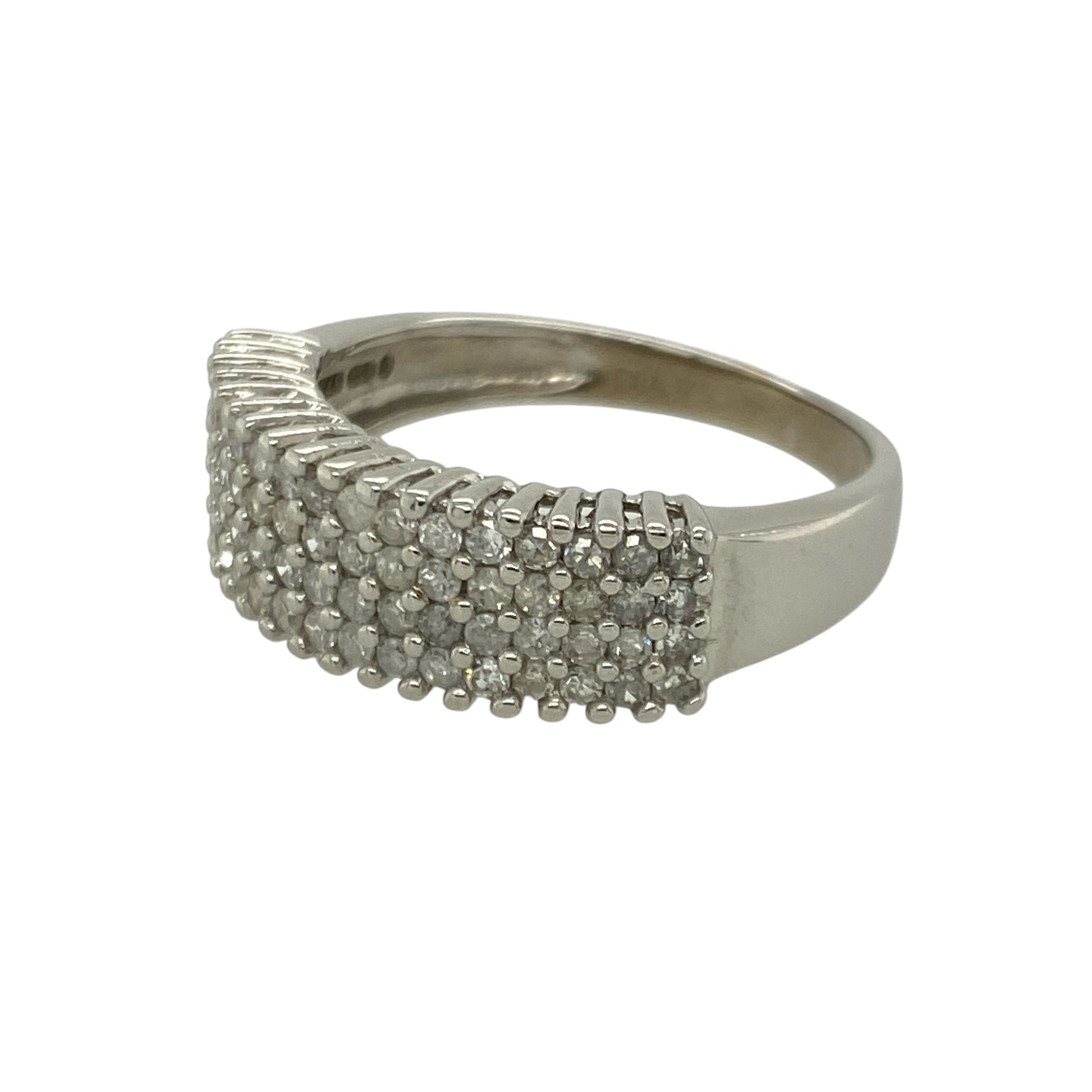 Bring bold sparkle and modern elegance to your collection with this pre-owned 9ct white gold four-row diamond band ring—an impressive piece offering radiant brilliance and contemporary style.

Design: This size P band features a 6mm wide front adorned with four rows of sparkling diamonds, creating a luxurious, light-catching display with approximately 0.75ct of total diamond content.
Material: Made from 9-carat white gold, the cool-toned polished finish enhances the diamonds’ bright, icy sparkle.