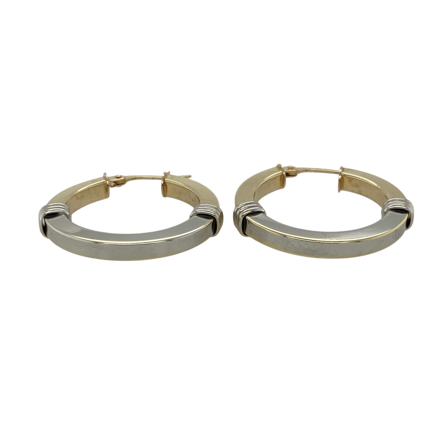 Bring elegant contrast and timeless shine to your collection with these pre-owned 9ct yellow and white gold two-tone creole earrings—an attractive pair offering refined style and everyday versatility.

Design: These hoop creole earrings feature a smooth two-tone finish, blending yellow and white gold for a sleek, modern look that catches the light beautifully.
Material: Made from 9-carat yellow and white gold, the polished surfaces highlight the elegant contrast between the warm and cool tones.