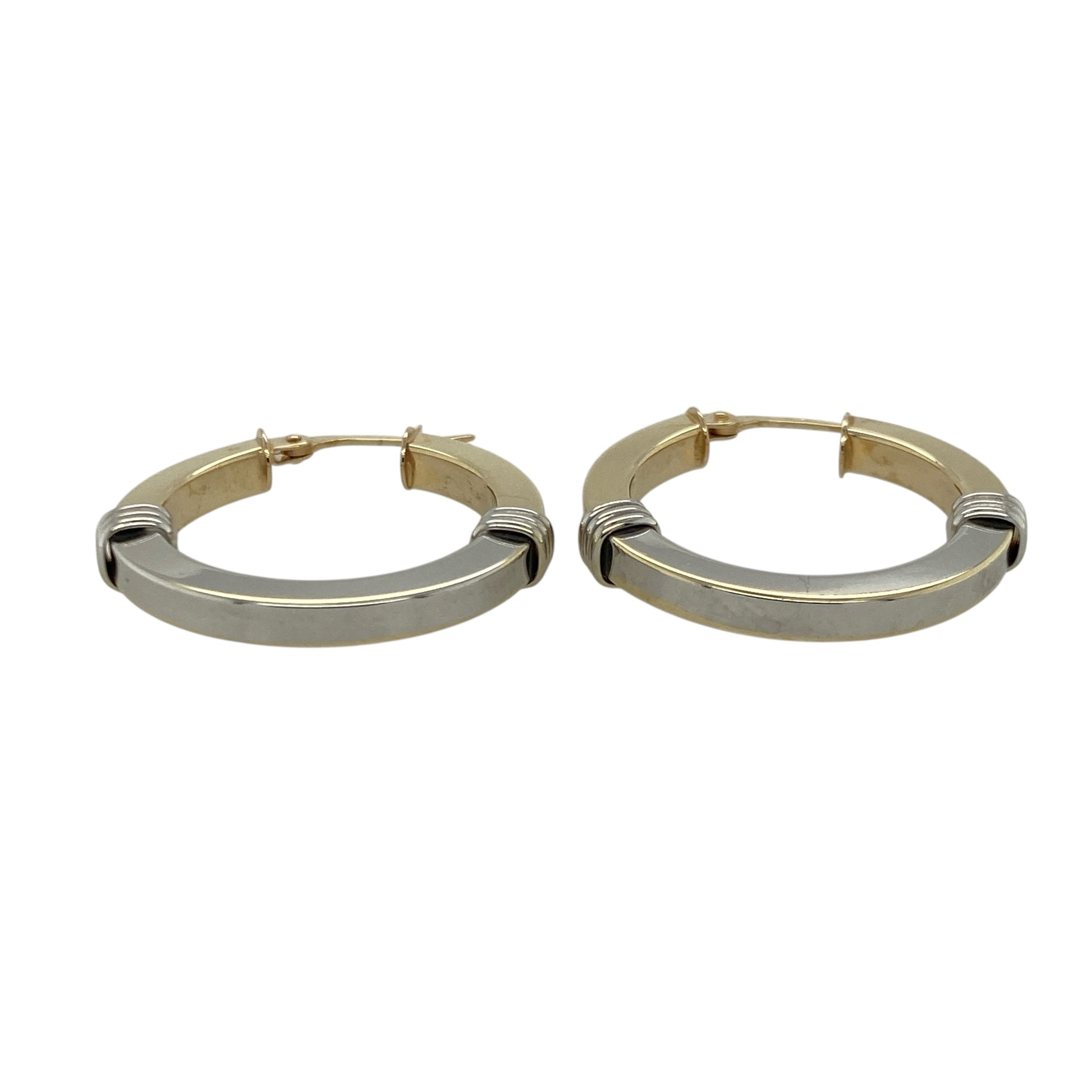 Bring elegant contrast and timeless shine to your collection with these pre-owned 9ct yellow and white gold two-tone creole earrings—an attractive pair offering refined style and everyday versatility.

Design: These hoop creole earrings feature a smooth two-tone finish, blending yellow and white gold for a sleek, modern look that catches the light beautifully.
Material: Made from 9-carat yellow and white gold, the polished surfaces highlight the elegant contrast between the warm and cool tones.