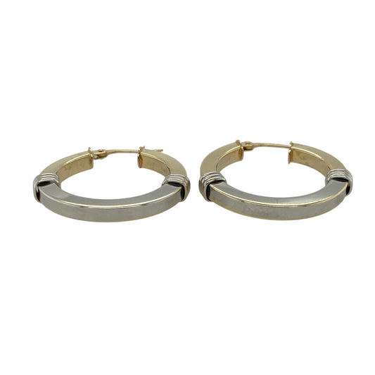 Bring elegant contrast and timeless shine to your collection with these pre-owned 9ct yellow and white gold two-tone creole earrings—an attractive pair offering refined style and everyday versatility.

Design: These hoop creole earrings feature a smooth two-tone finish, blending yellow and white gold for a sleek, modern look that catches the light beautifully.
Material: Made from 9-carat yellow and white gold, the polished surfaces highlight the elegant contrast between the warm and cool tones.