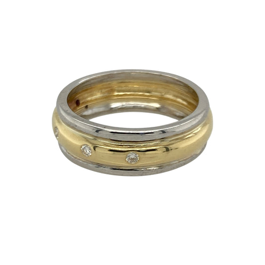 Bring elegant contrast and subtle sparkle to your collection with this pre-owned 18ct yellow and white gold diamond band ring—an attractive piece offering timeless style and refined detail.

Design: This size M band features a 6mm wide profile with three small diamonds set across the front, adding a touch of brilliance to its classic two-tone design.
Material: Made from luxurious 18-carat yellow and white gold, the polished finish enhances the warm and cool tones for a beautifully balanced look.
