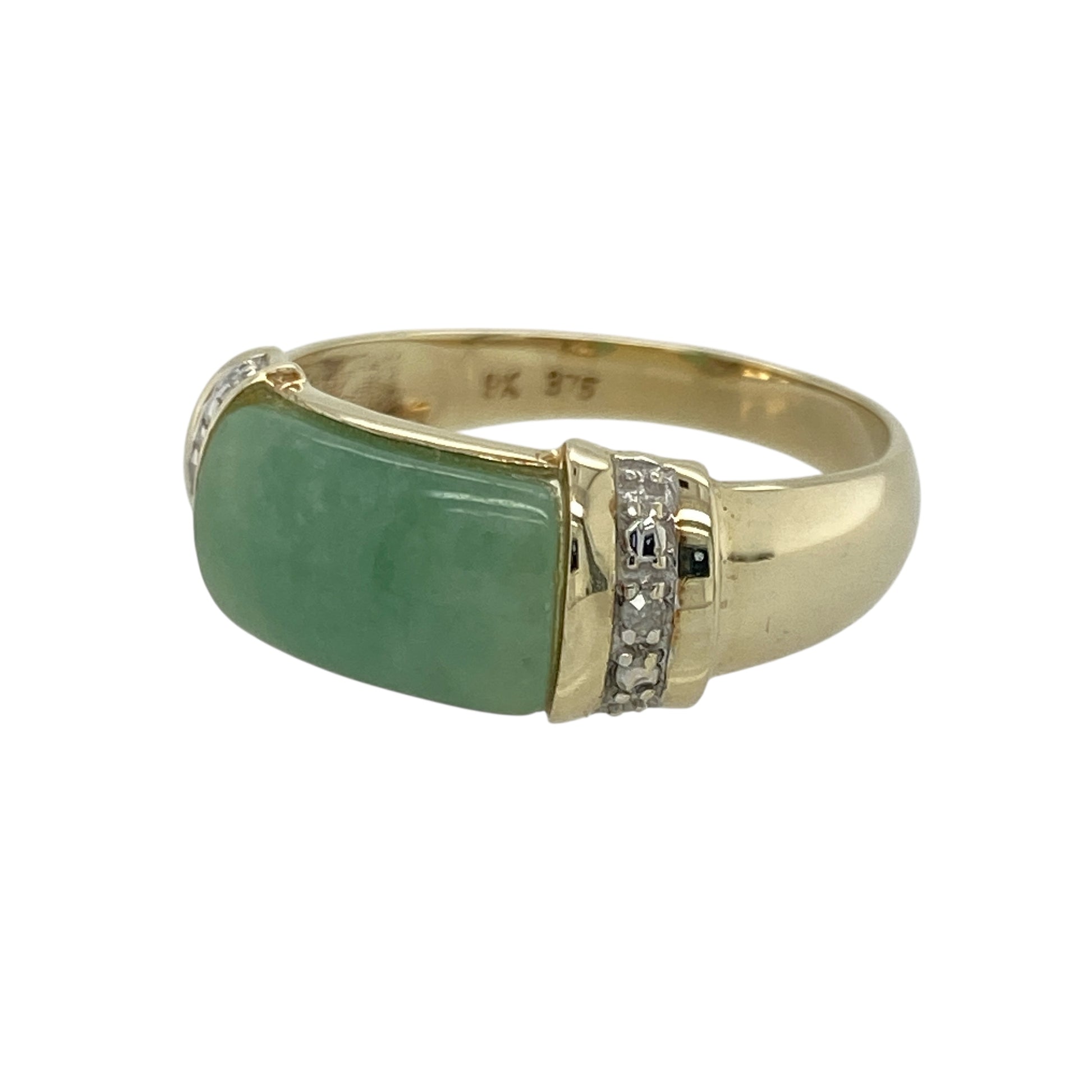 Bring serene colour and refined elegance to your collection with this pre-owned 9ct yellow gold jade and diamond ring—an eye-catching piece offering timeless beauty and graceful style.

Design: This size P ring features an approximately 7mm by 12mm jade stone, displaying its smooth, soothing green tone, accented by diamonds that add subtle sparkle and balanced detail.
Material: Made from 9-carat yellow gold, the polished finish provides a warm, classic glow that complements the natural beauty of the jade.