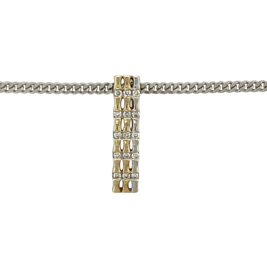 Bring modern elegance and refined sparkle to your collection with this pre-owned 9ct yellow and white gold diamond bar pendant necklace—an attractive piece offering contemporary style and timeless sophistication.

Design: This 2.2cm pendant features a sleek bar design in contrasting yellow and white gold, accented with diamonds for a clean, stylish sparkle.
Material: Made from 9-carat yellow and white gold, the polished finish enhances the two-tone contrast while complementing the bright diamond detailing.