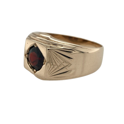 Bring rich colour and warm rosy tone to your collection with this pre-owned 9ct rose gold garnet signet ring—an elegant piece offering timeless style and refined character.

Design: This size Q ring features a 6mm round garnet at the centre, framed by patterned shoulders that add texture, depth, and a classic signet-inspired look.
Material: Made from 9-carat rose gold, the polished finish enhances the soft blush tone of the metal and complements the deep red of the garnet.